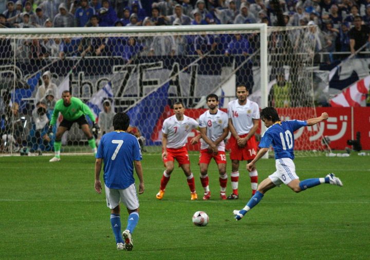 This is a photo of an attacking free-kick being taken in football.