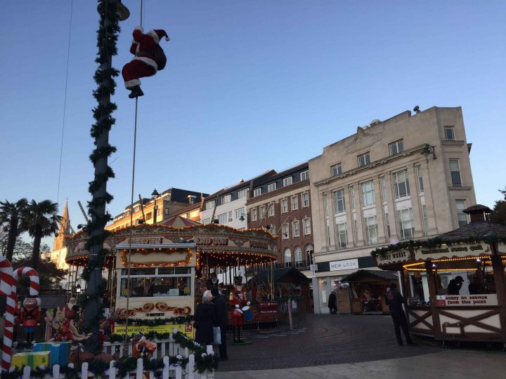 Carousel and stalls at Christmas market