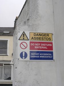 Photo of an asbestos warning sign, courtesy of Nina A.J. on Flickr