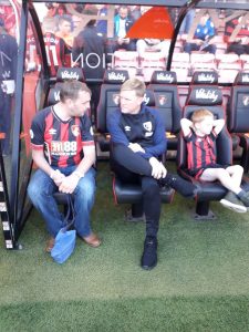 Jamie Bird sat with Bournemouth manager Eddie Howe