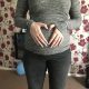 Pregnant,woman,holding,her,bump