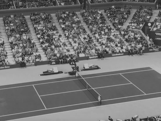 Tennis court with players during a match