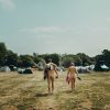 A naked couple walking at a BN event. Credit: British Naturism