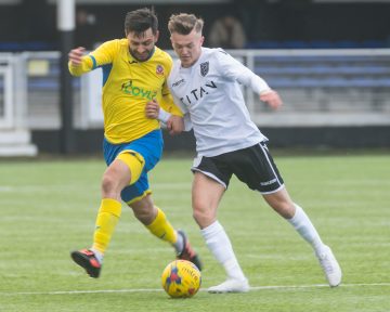 People playing in a Non-League football match