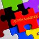 Jigsaw image with a piece out of place with 'autism awareness' on it.