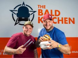 two men holding burgers