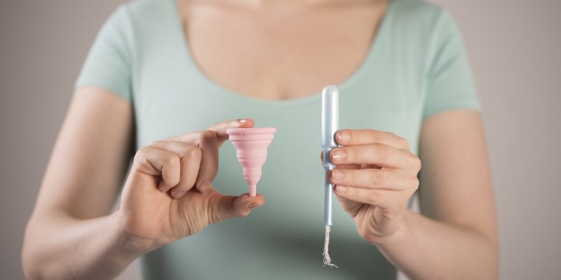 A women displaying tampon products