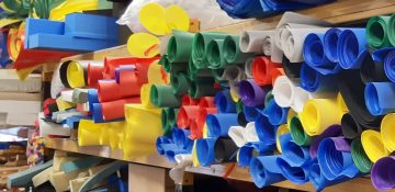 Rolls of material on the store's shelves