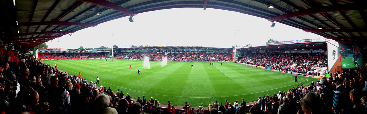 Dean Court by Matthew Jackson CC BY-SA 3.0 - Panorama of Goldsands Stadium (Dean Court) from East Stand. Prior to Football League Championship fixture 14/9/2013 AFC Bournemouth v Blackpool FC.