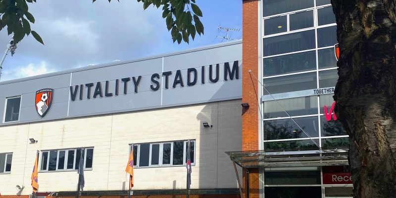 AFC Bournemouth's home stadium, The Vitality - pictured is the main entrance to the stadium with the AFC Bournemouth logo and 'Vitality Stadium' written on the side