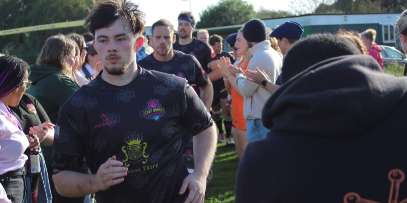 Ethan Mullan running onto the pitch.