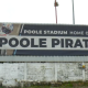 A banner for Poole Pirates outside Poole Stadium, it says 'Poole Stadium, home of the Poole Pirates'