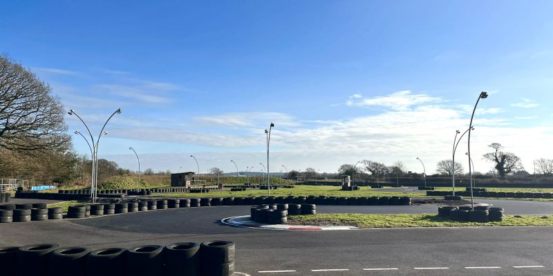 A race track with tyres around the edges working as a barrier