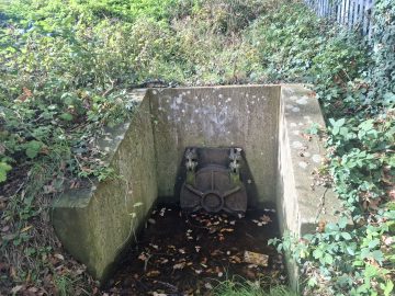A sewage outflow pipe in Iford paying field, which pumps raw sewage a few meters from where locals kids play and people walk their dogs.