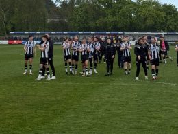 Wimborne Town club clapping after game.