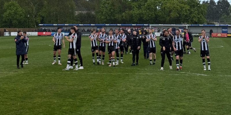 Wimborne Town club clapping after game.