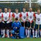 Blandford and Sturminster team photo stood in front of hockey goal
