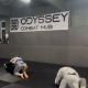Fighters practice wrestling in Odyssey Combat Hub