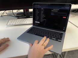 woman on her laptop, deactivating her X account.