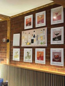 Pictures of various drinks on the walls of Crete Island