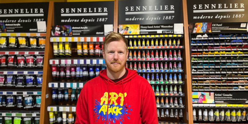 man in stationary shop