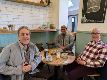 Volunteers gather around the table at the food bank in Boscombe