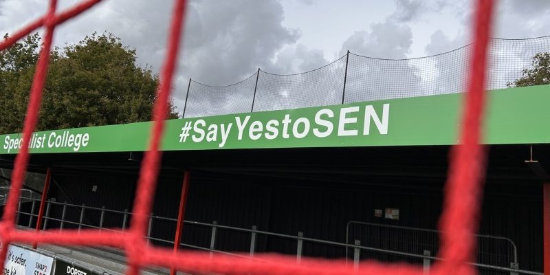 A sign with SEN through the net.